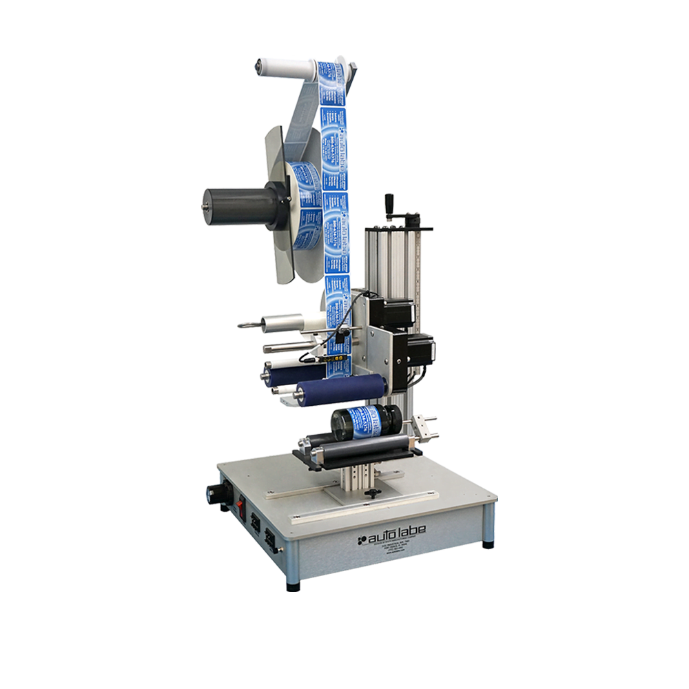 Auto Labe Model 550S Semi-Automatic Labeler applying labels to cylindrical bottles for small to mid-sized production lines.
